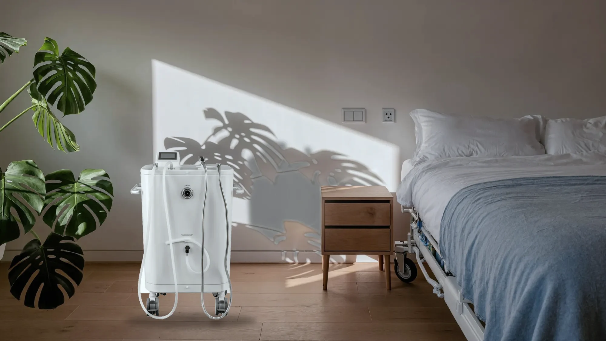 The Wishower beside a bed in a bright patient room