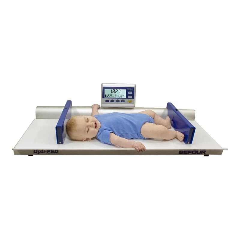 An infant lying on the tray of the Befour Opti-PED