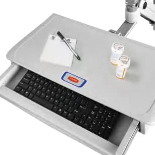 Work surface of a Capsa Fluid arm with its keyboard drawer open