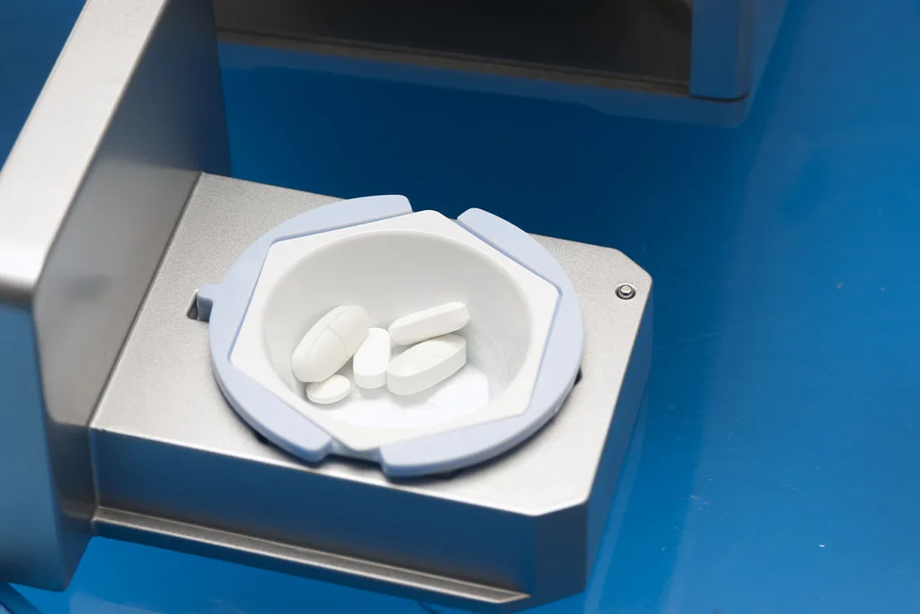 Tablets in a cup inside the SafeCrush drawer